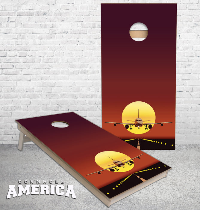 Airliner Landing in front of a sunset sky cornhole boards