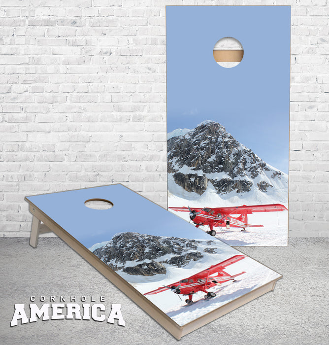 Airplane on the side of a mountain in the snow cornhole boards