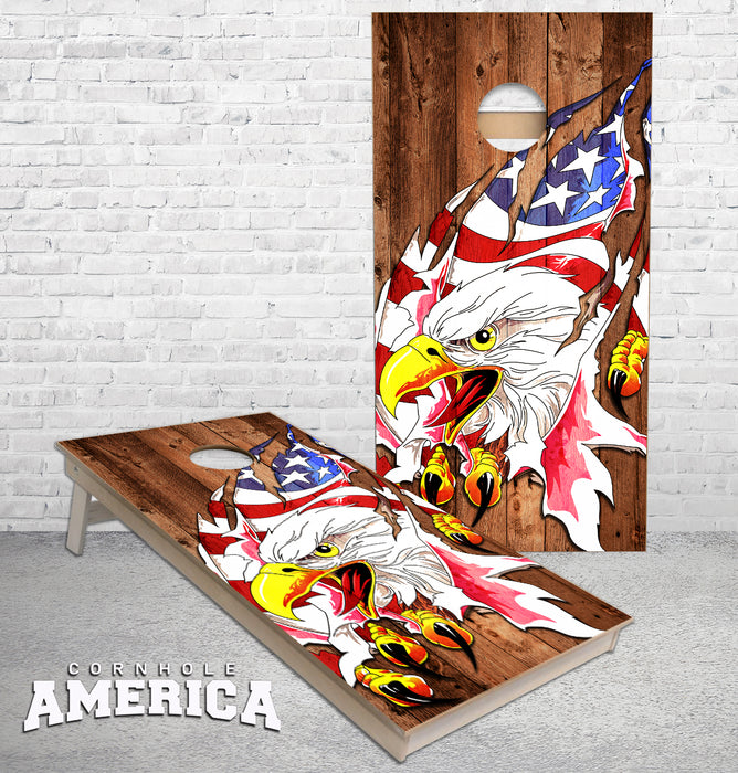 Eagle Claws ripping through the wood cornhole boards