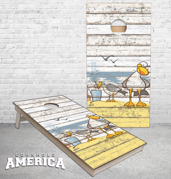 Weird Sea Gulls on beach washed wood cornhole boards