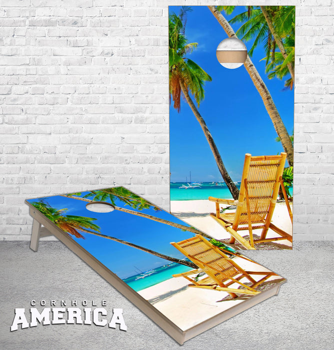 Wicker Beach Chair on a beautiful white sand beach palm trees cornhole boards