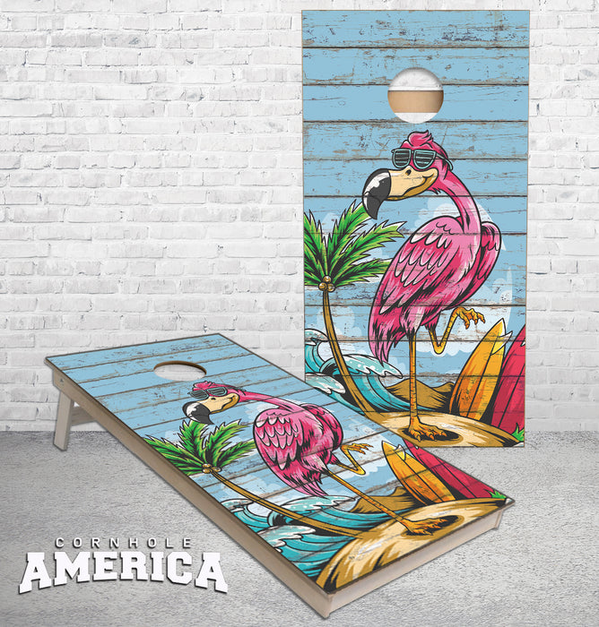 Pink Flamingo on the beach clear blue sky on weathered wood cornhole boards