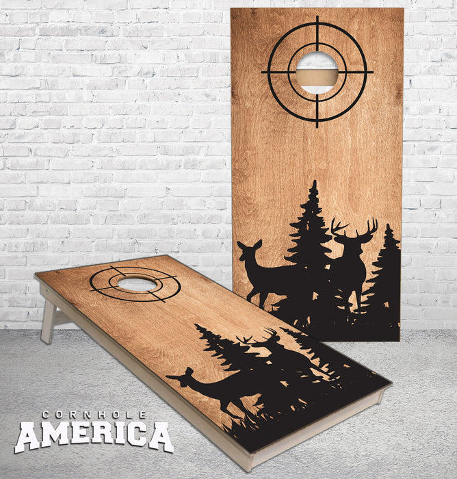 Doe and Buck silhouette on medium brown cornhole boards